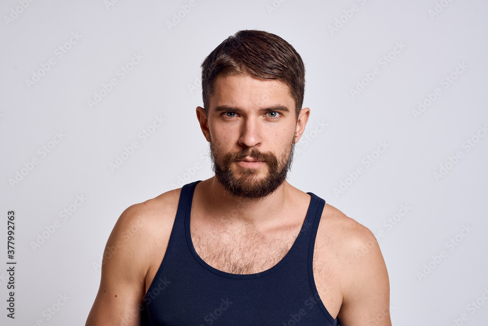 portrait of a man in a T-shirt on a light background massager scalp care model portrait of a man in a T-shirt on a light background massager scalp care model