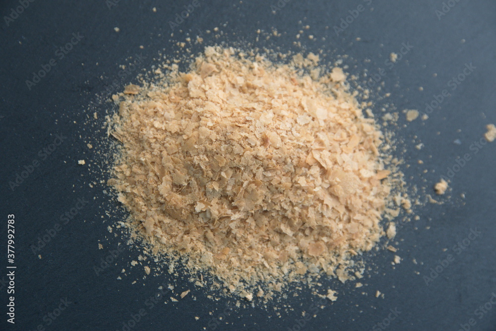 Dry Baker's yeast, beer yeast on grey stone background Dry Baker's yeast, beer yeast on grey stone background