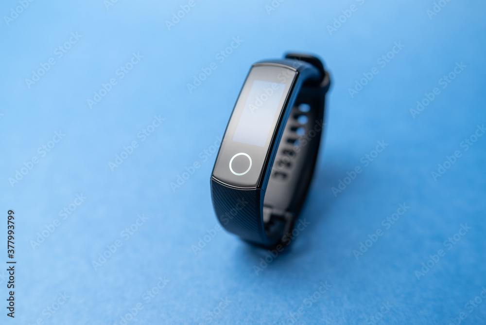 fitness bracelet on blue background fitness bracelet on blue background
