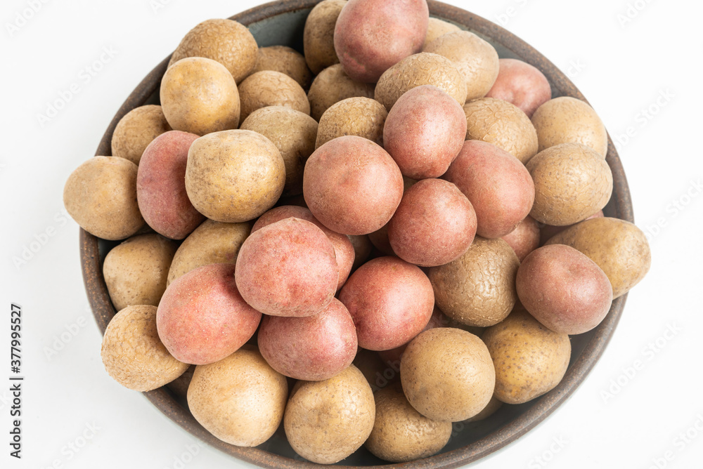 Top View Of Raw And Fresh Baby Potatoes In A Ceramic Bowl Top View Of Raw And Fresh Baby Potatoes In A Ceramic Bowl