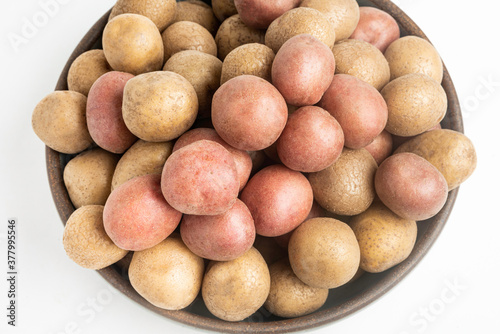 Top View Of Raw And Fresh Baby Potatoes In A Ceramic Bowl