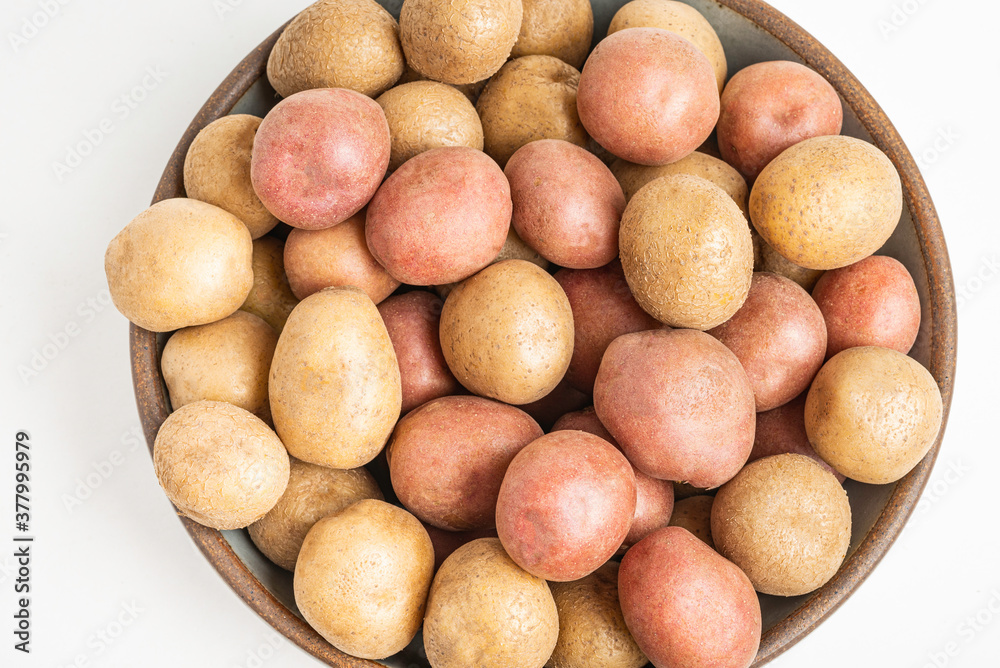 Top View Of Raw And Fresh Baby Potatoes In A Ceramic Bowl Top View Of Raw And Fresh Baby Potatoes In A Ceramic Bowl