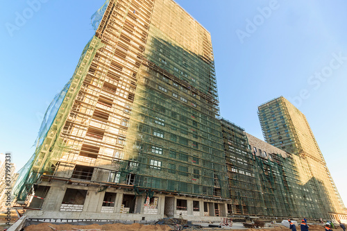 construction site of a building - facade with scaffolding photo