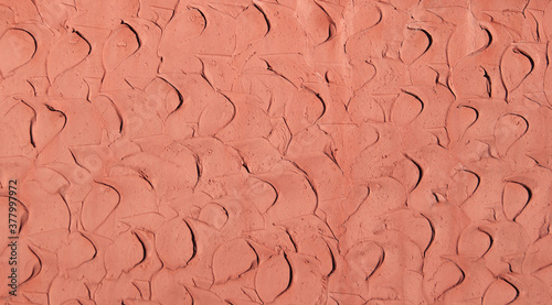 Coral clay plaster walls, for use as a background and texture.