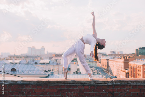 
Girl in white on the roof