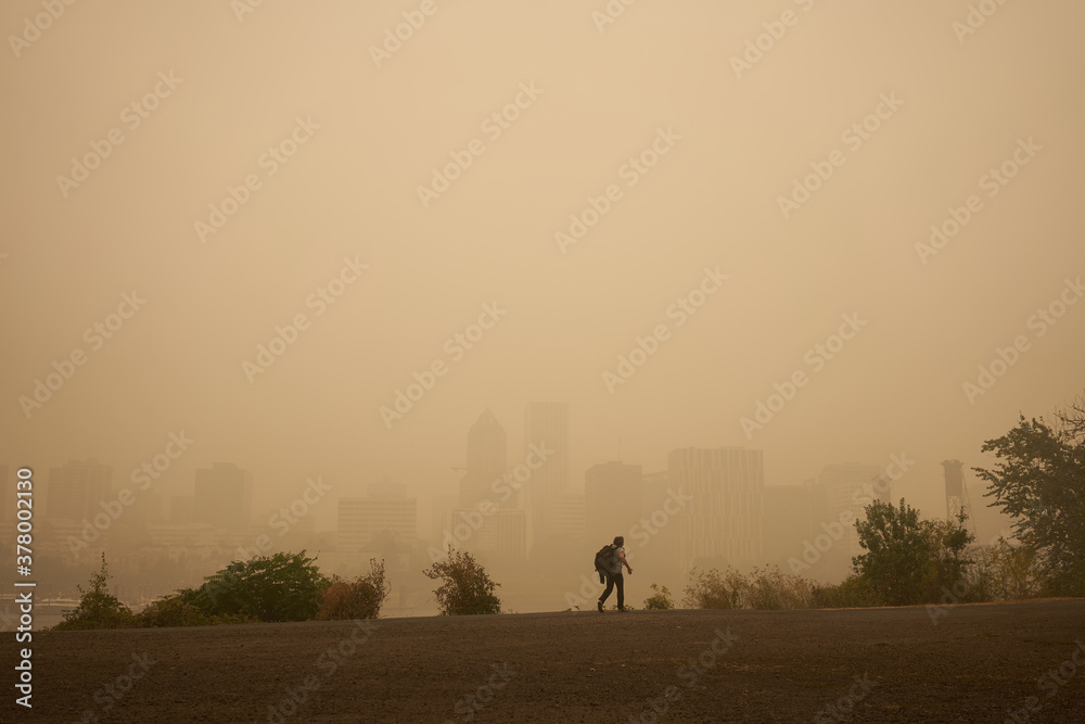 An orange smoke-filled sky is seen above Portland's downtown skyline during the Oregon wildfires.