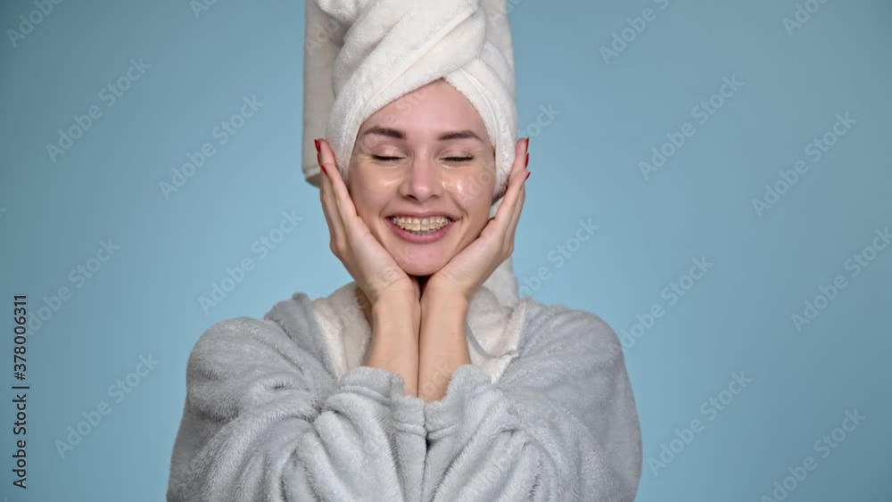 A young woman takes care of her face. Applies moisturizing patches. A young woman takes care of her face. Applies moisturizing patches.