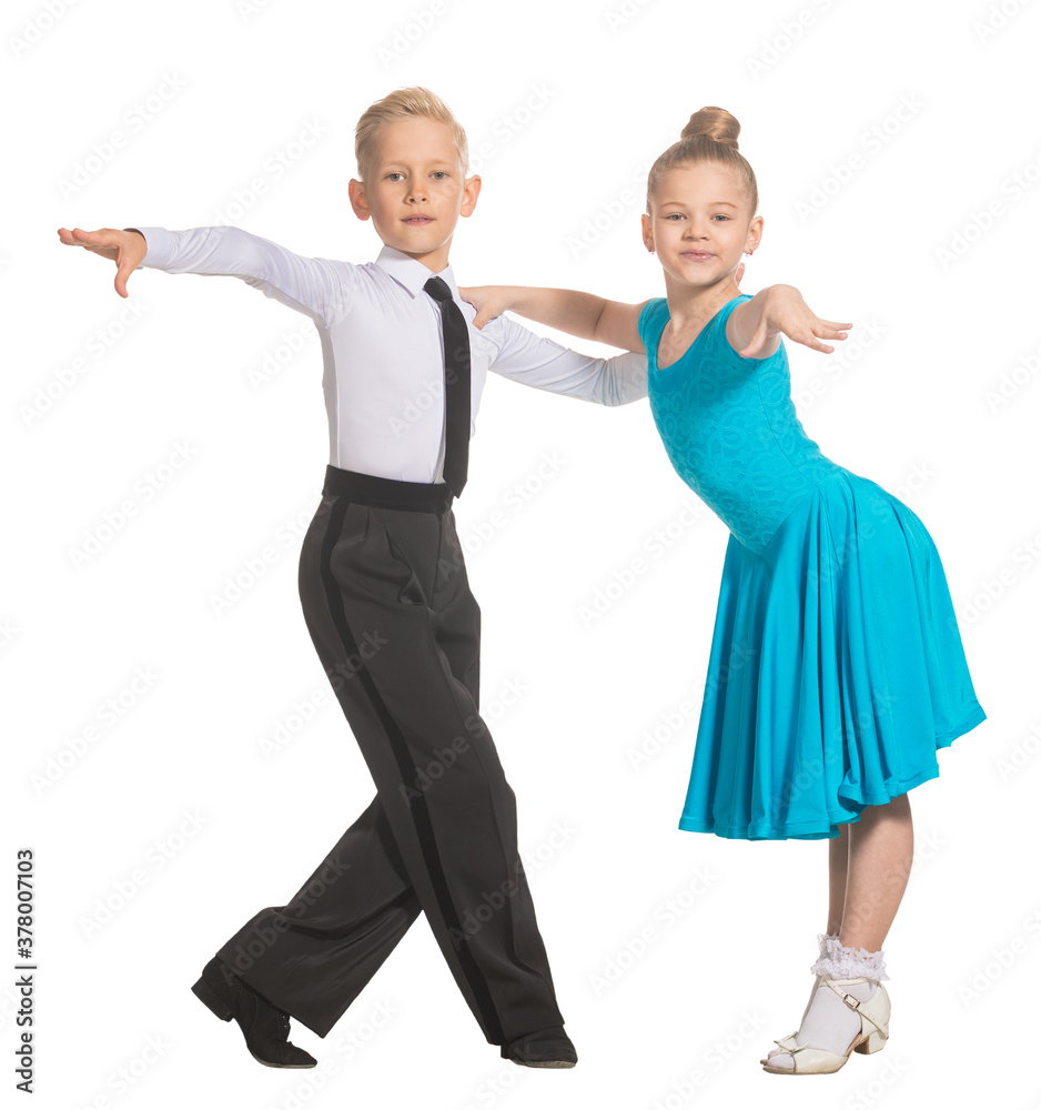 Sports ballroom dancing. Couple of kids, boy and girl on isolated white background Sports ballroom dancing. Couple of kids, boy and girl on isolated white background