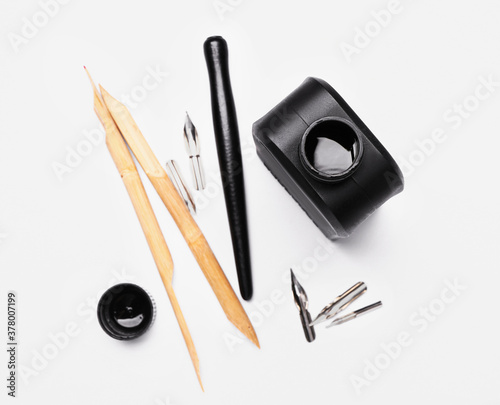 Pens with ink on white back...