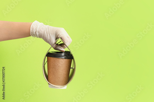 Hand in Disposable Glove Ho...