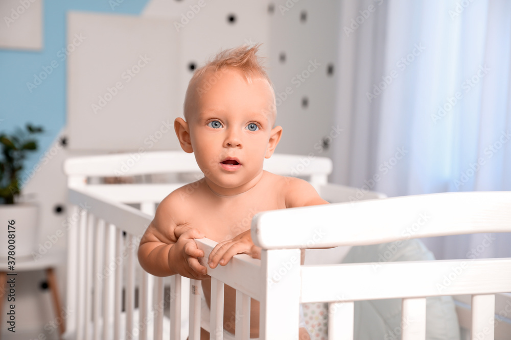 Cute little baby in bed at home Cute little baby in bed at home