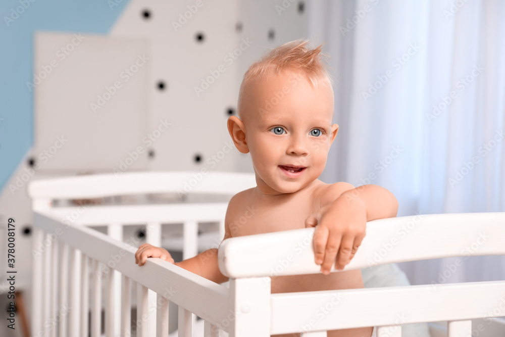 Cute little baby in bed at home Cute little baby in bed at home