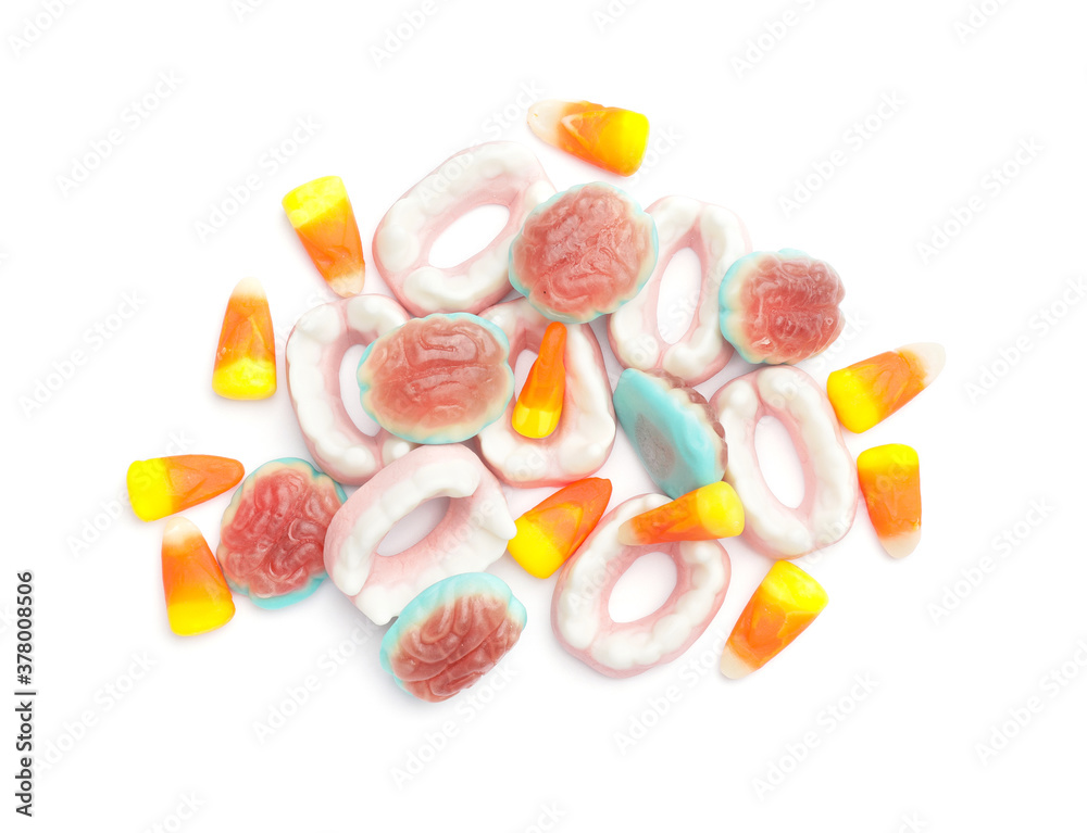 Tasty scary candies for Halloween on white background