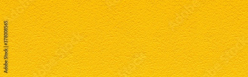Panorama of Rough patterned yellow cement wall texture and seamless background