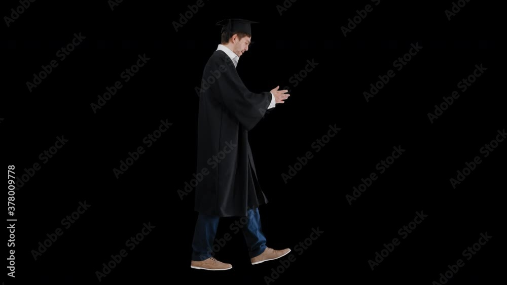 Happy male student in graduation robe walking and kissing his diploma, Alpha Channel Happy male student in graduation robe walking and kissing his diploma, Alpha Channel
