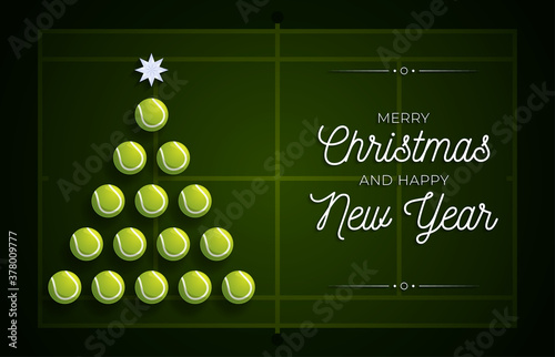 Christmas and new year greeting card. Creative Xmas tree made by tennis ball on tennis field background for Christmas and New Year celebration. Sport greeting card