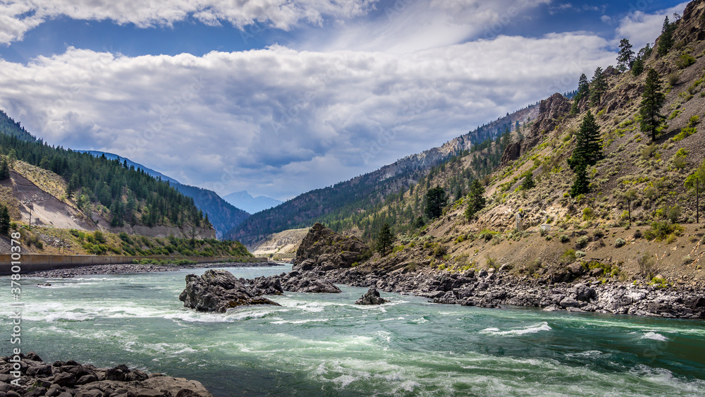 Thompson River with its many rapids flowing through the Canyon in the Coastal Mountain Ranges of British Columbia, Canada Thompson River with its many rapids flowing through the Canyon in the Coastal Mountain Ranges of British Columbia, Canada