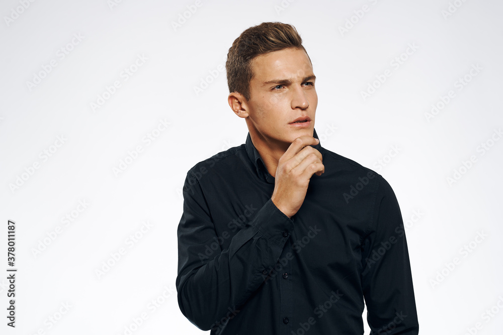 manager in black shirt official cropped view light background