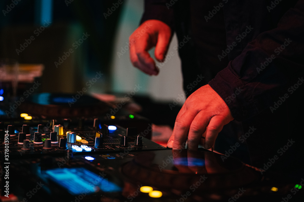 DJ's hands playing on his board DJ's hands playing on his board