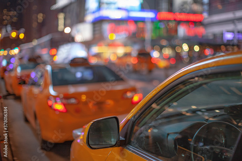 Fototapeta NYC yellow cabs at night