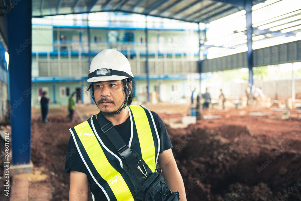 Engineer asian man worker in safety white helmet and vest checking project maintenance daily on site outdoor. civil engineer or architect with hardhat on construction site. Engineer asian man worker in safety white helmet and vest checking project maintenance daily on site outdoor. civil engineer or architect with hardhat on construction site.