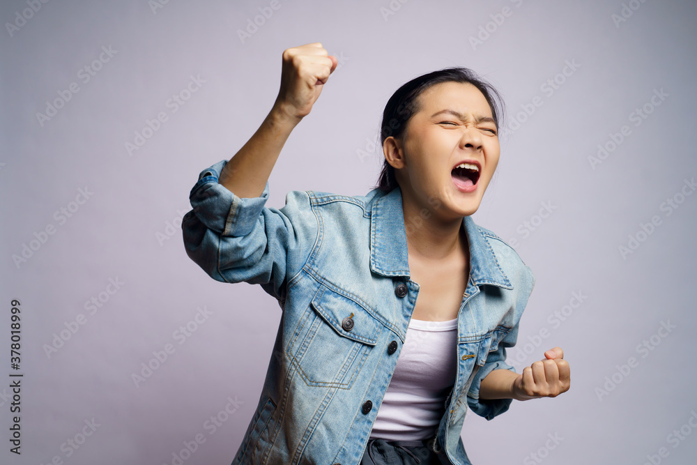 Asian woman shouting isolated over white background.