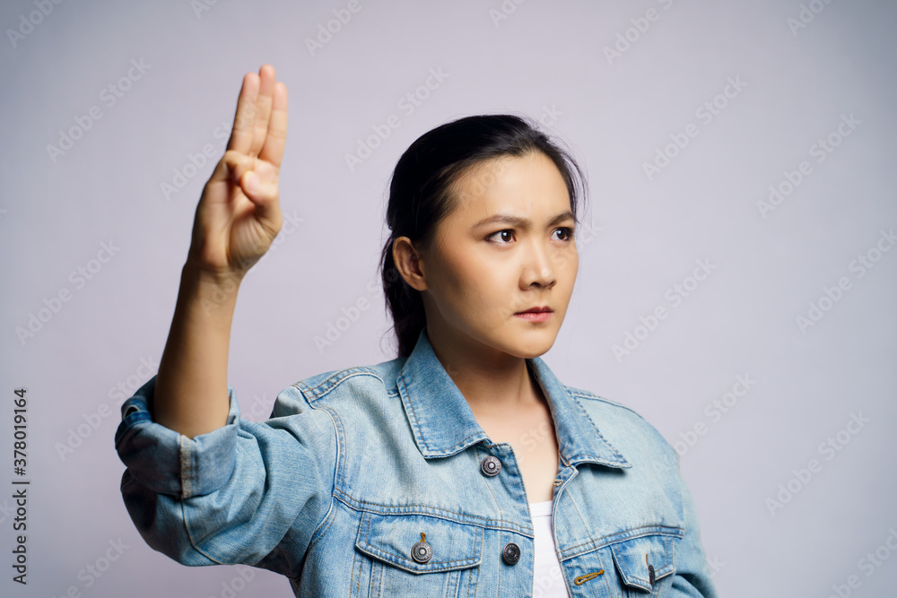 Asian woman showing three finger isolated over white background. Asian woman showing three finger isolated over white background.