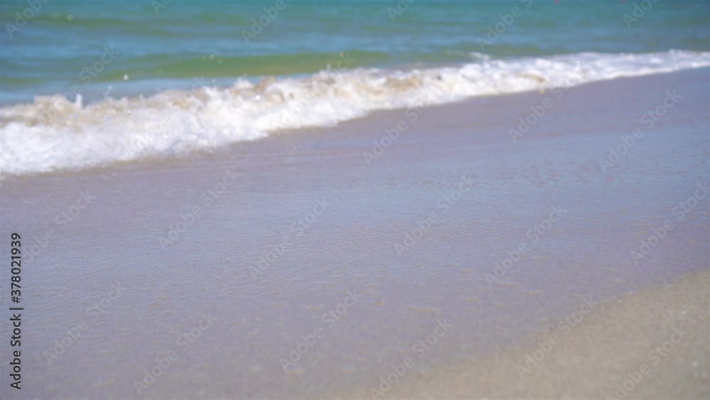 Idyllic tropical beach with white sand, turquoise sea water and beautiful colorful sky Idyllic tropical beach with white sand, turquoise sea water and beautiful colorful sky