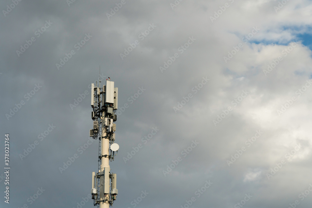 RF Communication tranmission towers under cloudy sky
