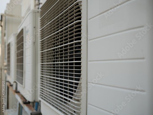 air conditioner compressor outside building.