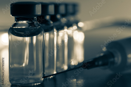 Image with syringe and bottle with old background