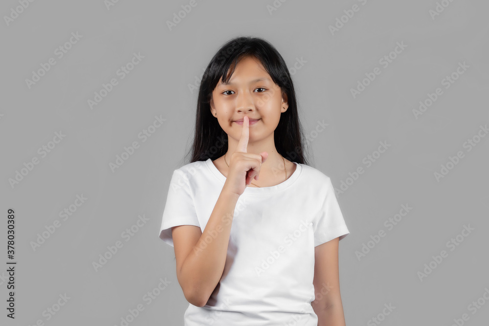 Asian girl studio portrait on gray background Asian girl studio portrait on gray background