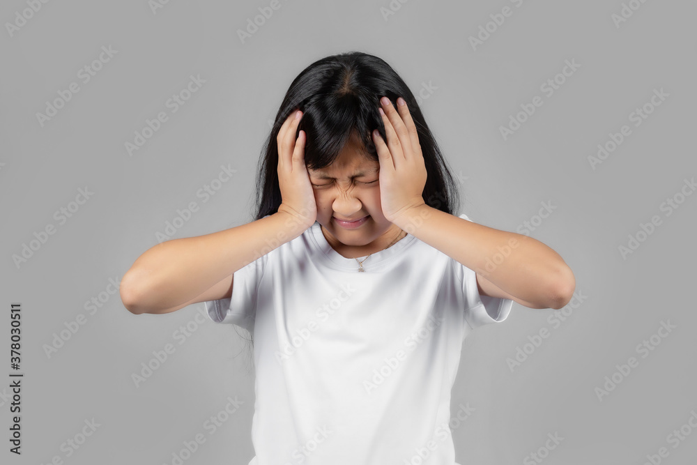 Asian girl studio portrait on gray background Asian girl studio portrait on gray background