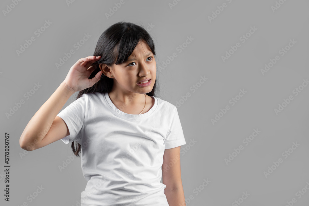 Asian girl studio portrait on gray background