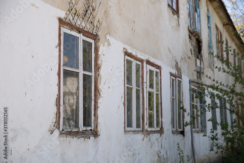 Old dilapidated  weather-beaten house that needs to be renovated. Housing problem