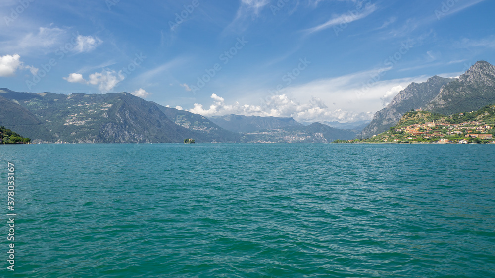 Amazing landscape at Lake Iseo. An alpine lake in north of Italy. Famous tourist destination. Natural and holiday contest