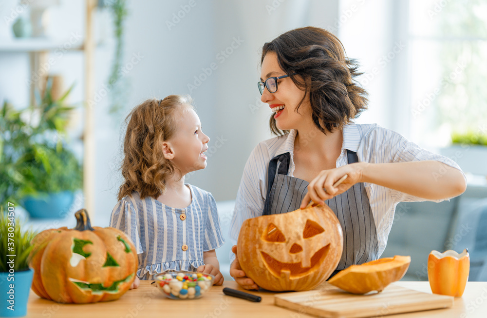 Happy family preparing for Halloween.