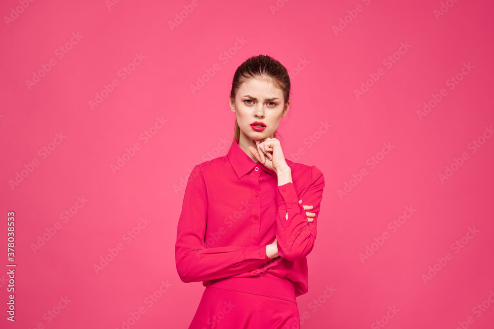 Woman on a pink background in fashionable clothes and bright makeup hairstyle model Copy Space Woman on a pink background in fashionable clothes and bright makeup hairstyle model Copy Space
