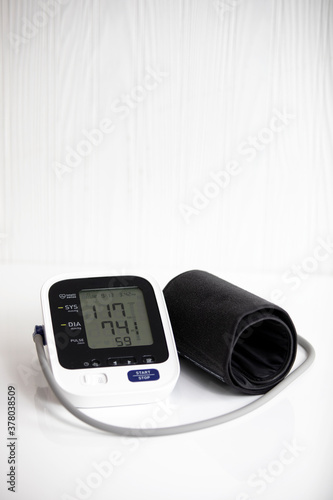 Blood pressure monitor, white background vertical