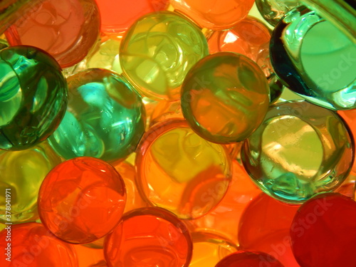 Water colourful gel balls. Polymer gel. Silica gel. Balls of colourful hydrogel. Crystal liquid ball with reflection.