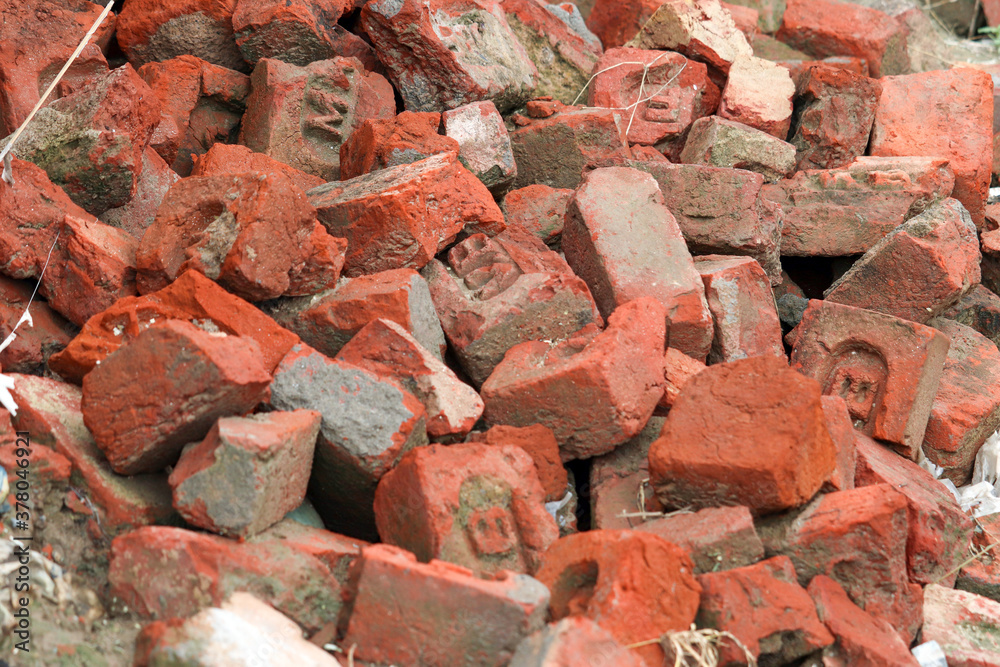 A pile of debris, broken pieces of brick A pile of debris, broken pieces of brick
