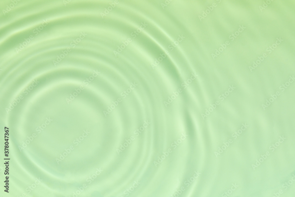 Closeup of mint green transparent clear calm water surface texture with splashes and bubbles. Trendy abstract summer nature background. Mint colored waves in sunlight. Closeup of mint green transparent clear calm water surface texture with splashes and bubbles. Trendy abstract summer nature background. Mint colored waves in sunlight.