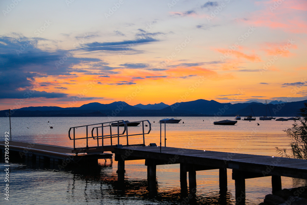 Sunset with landing stage in Bardolino, Italy