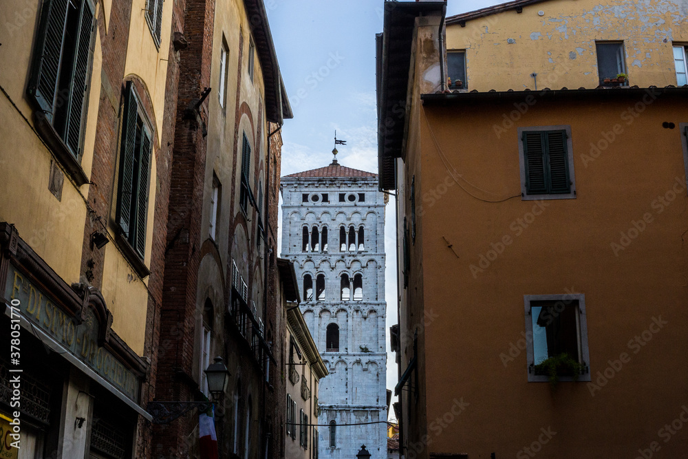 View of San Michele in Foro Church Tower between Buildings, Lucca, Italy