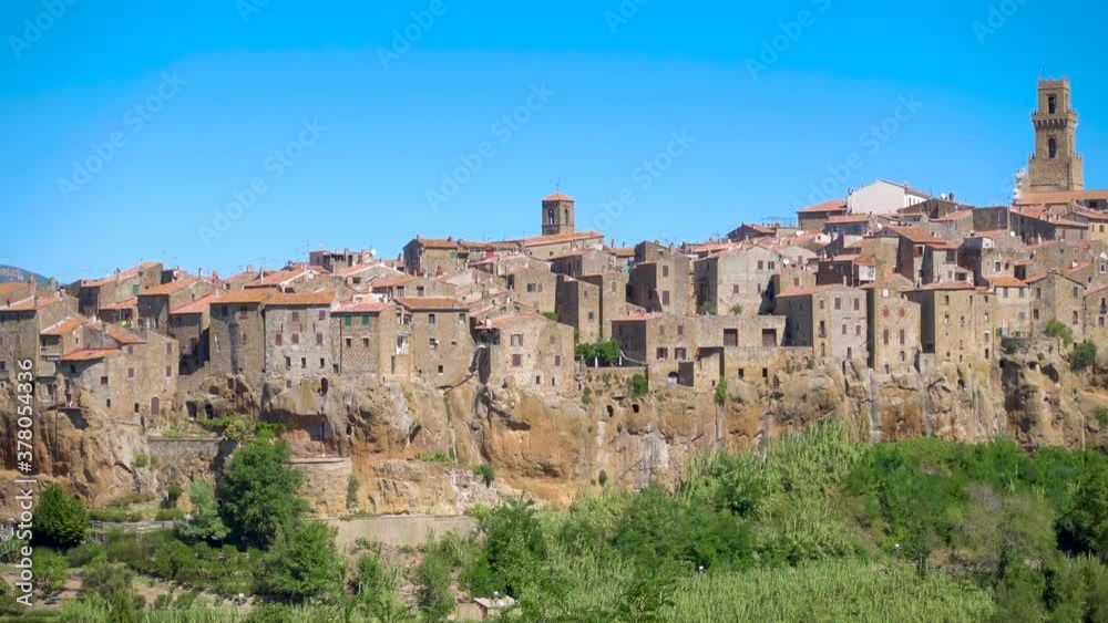 Pitigliano, Tuscany perched on tuff cliff, Old Town and alleys. Splendid town in the Tufo Area, in the heart of Tuscan Maremma, Pitigliano perched on tuff cliff one of most beautiful villages in Italy Pitigliano, Tuscany perched on tuff cliff, Old Town and alleys. Splendid town in the Tufo Area, in the heart of Tuscan Maremma, Pitigliano perched on tuff cliff one of most beautiful villages in Italy