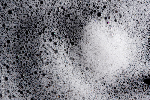 Abstract background white soapy foam texture. Shampoo foam with bubbles © Nattapol_Sritongcom