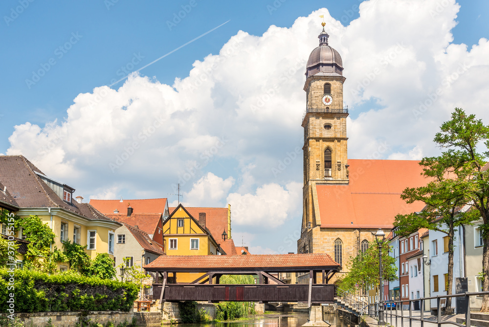 View at the Basilica of St.Martin with Wooden bridge over Vils river in Amberg, Germany