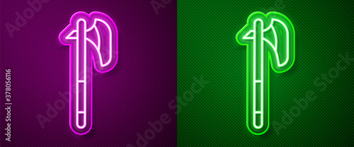 Glowing neon line Medieval axe icon isolated on purple and green background. Battle axe, executioner axe. Medieval weapon. Vector.