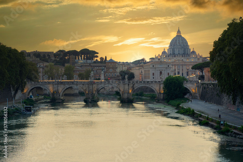 Sunset View on Vatican City and St. Peter Basilica from a bridge over a Tiber River