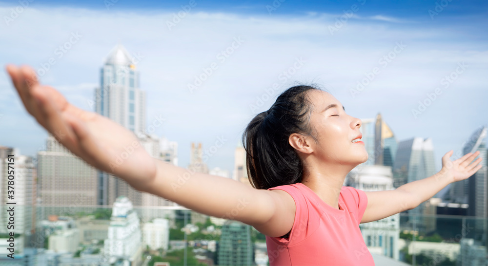 Asian beautiful woman in pink sports uniform doing relax after work out Asian beautiful woman in pink sports uniform doing relax after work out